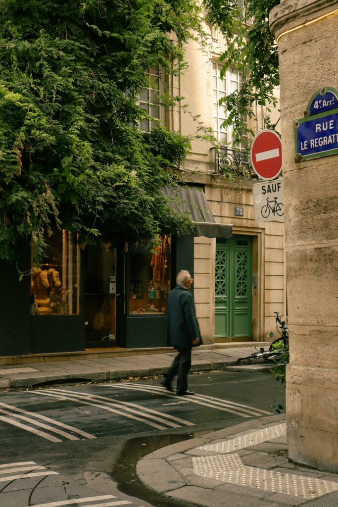 A woman walking down a street in paris