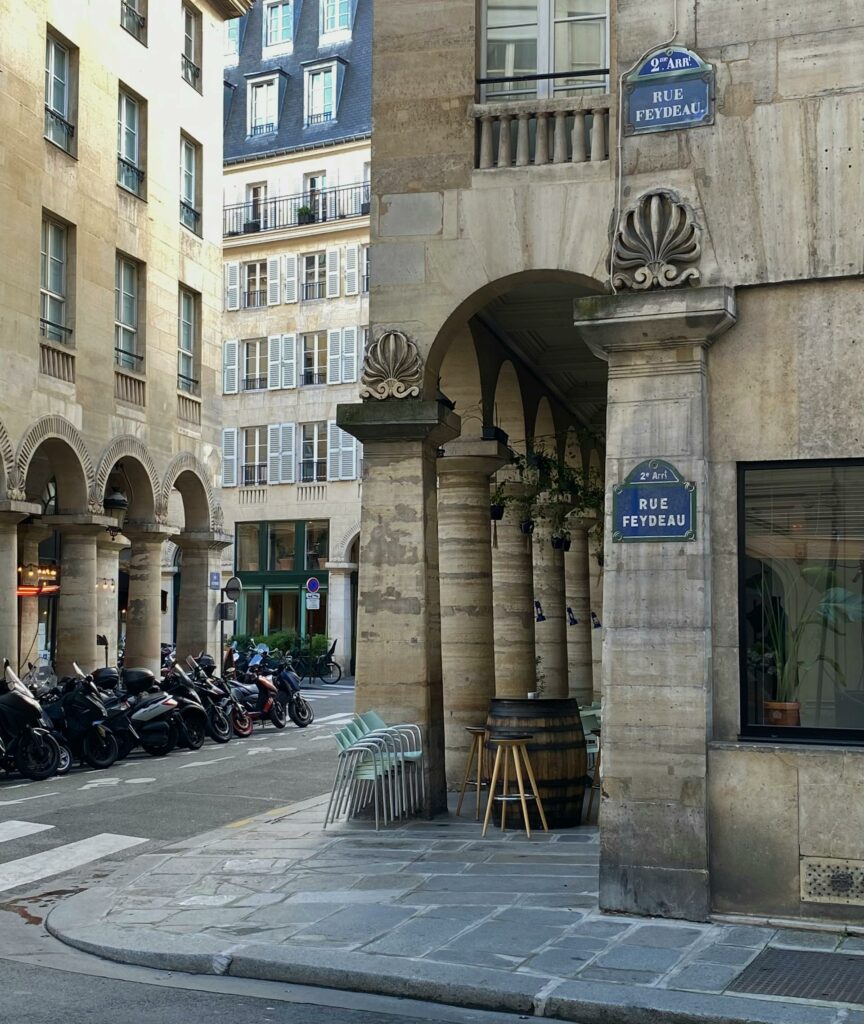 Motorcycles Parked Near the Brown Concrete Building